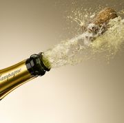 champagne cork shooting from bottle