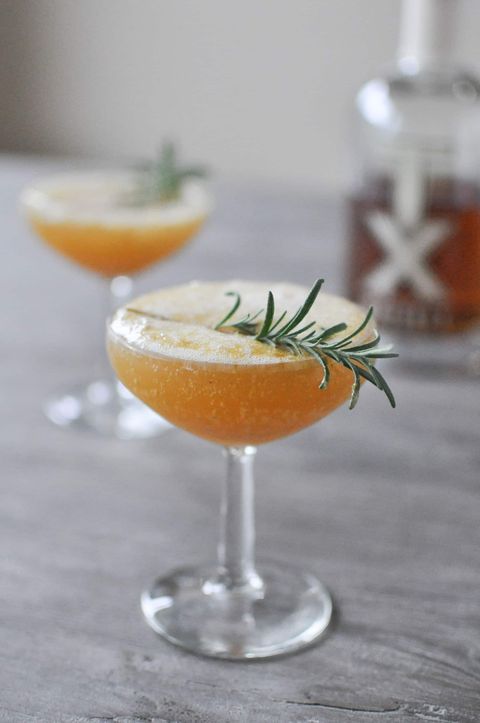the harvest sparkle with rosemary in coupe glass