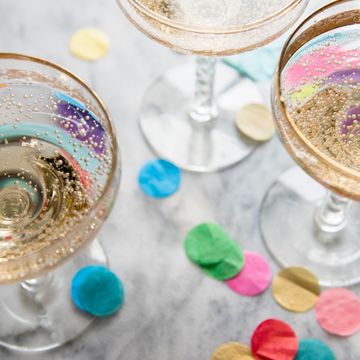 champagne coupe glasses with confetti