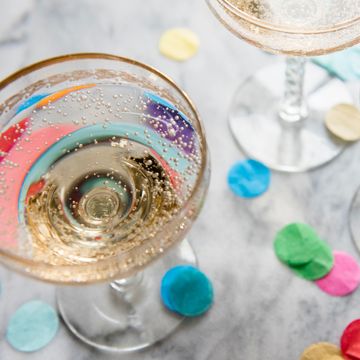 champagne coupe glasses with confetti