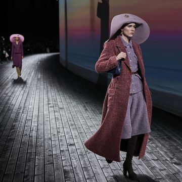 a person wearing a pink coat and hat
