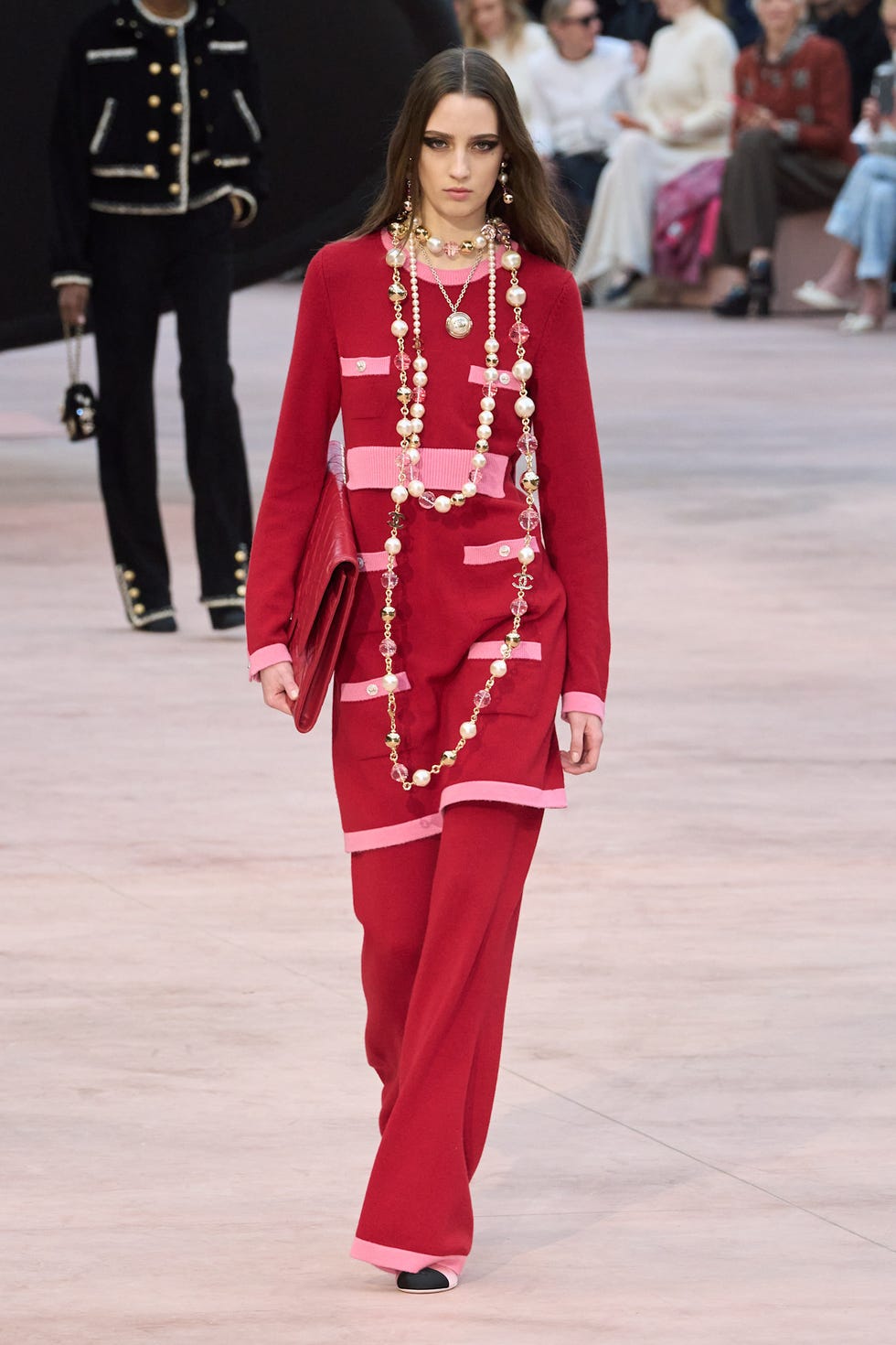 fashion model showcasing a red outfit with accessories