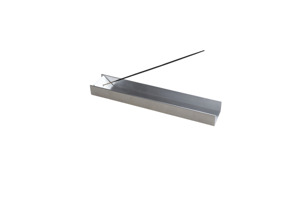 a rectangular, aluminium incense holder
