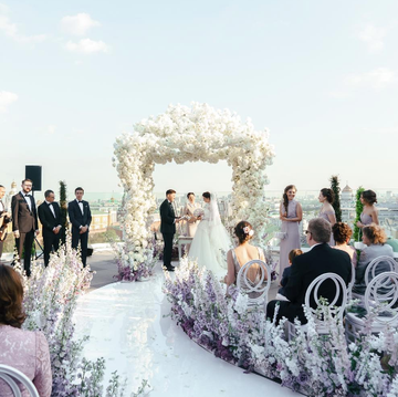 a group of people in wedding attire