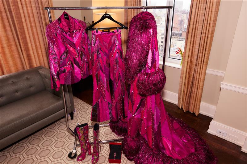 fashion display featuring a vibrant pink outfit with sequins