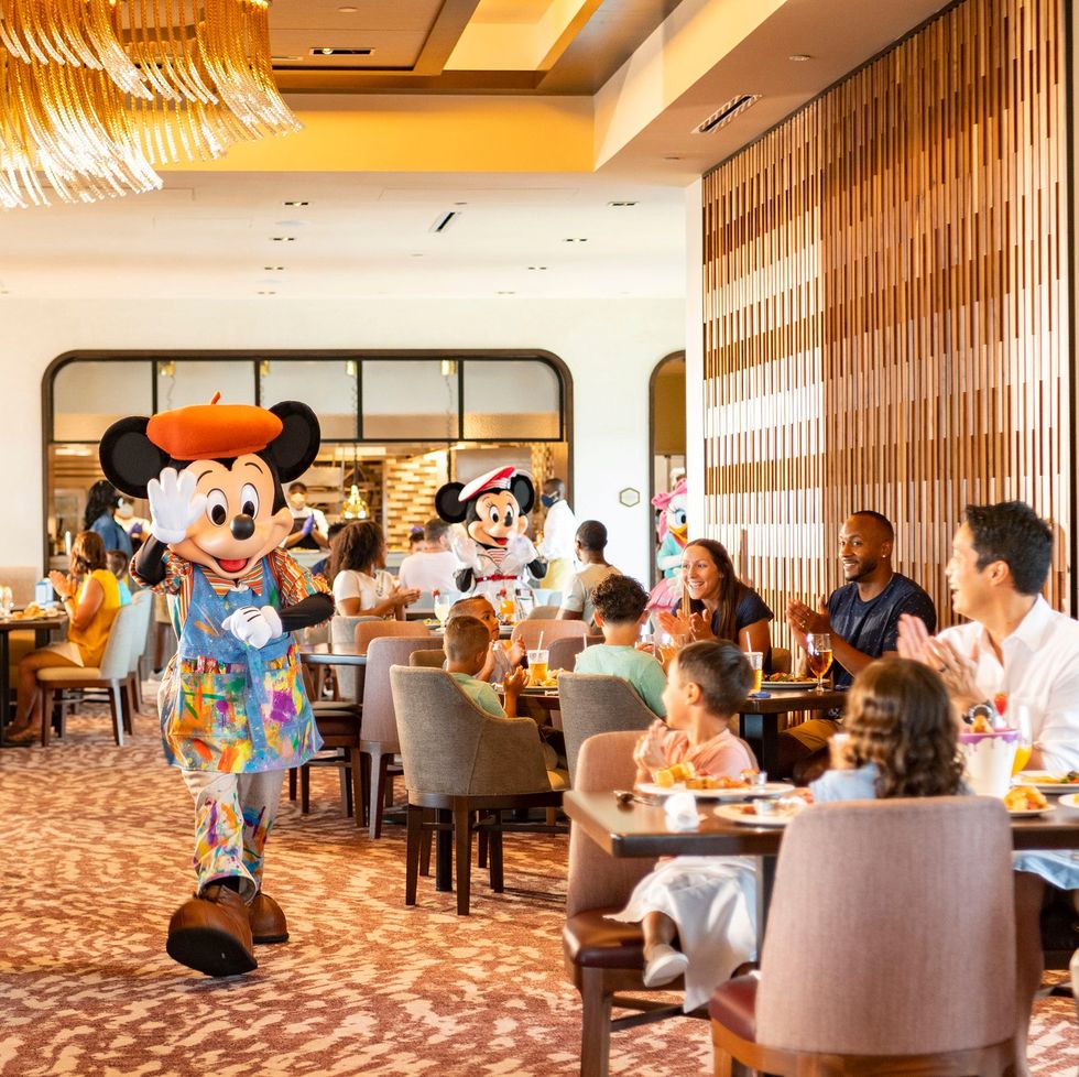guests and mickey mouse at disney's topolino's terrace restaurant