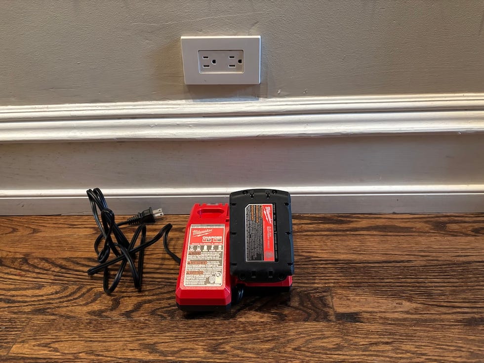an unplugged battery and charger for a power tool