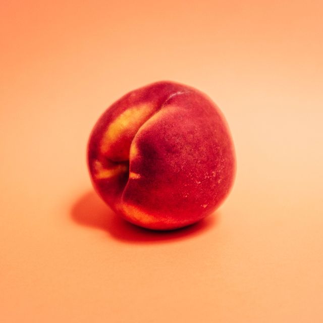 a peach symbolizing a butt