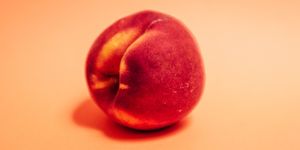 a peach symbolizing a butt