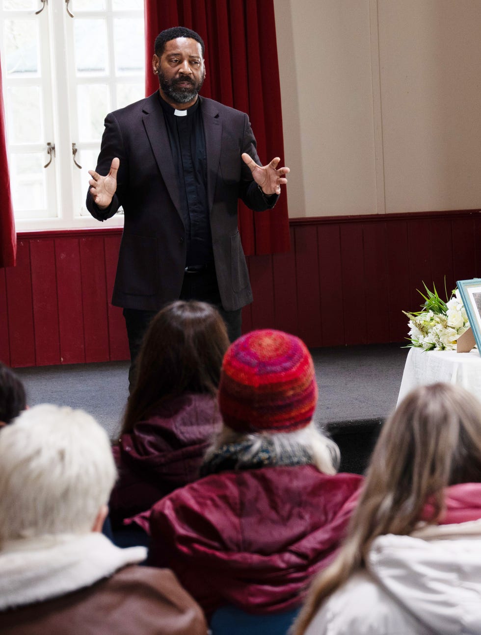 Community vigil in the village⁢ hall