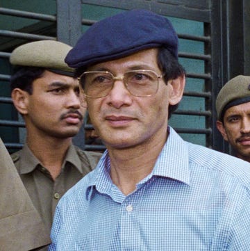 charles sobhraj is escorted by police to a new delhi court on 12 april 1994