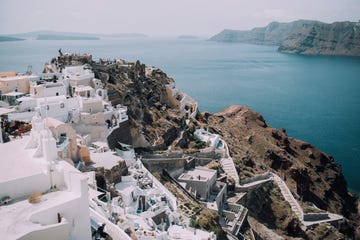 a city on a cliff by the sea