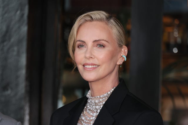 Charlize Theron just styled her hair into a micro ponytail