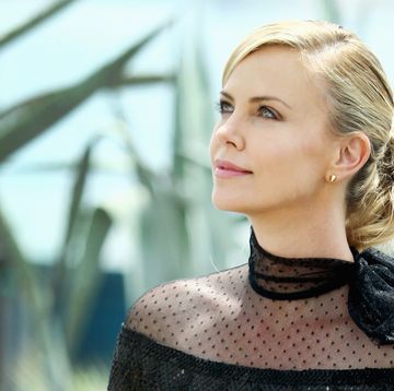 cannes, france   may 14  charlize theron looks up after she leaves a photocall for mad max fury road during the 68th annual cannes film festival on may 14, 2015 in cannes, france  photo by andreas rentzgetty images