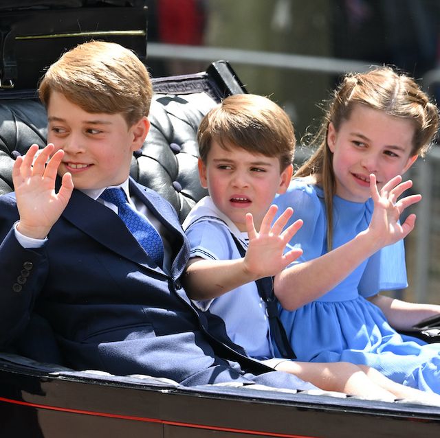 charlotte and louis wave and sit alongside george in a carriage