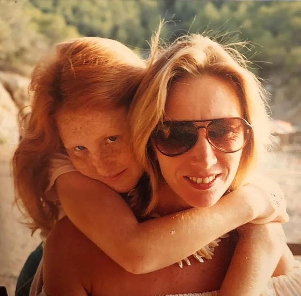 a woman holding a baby