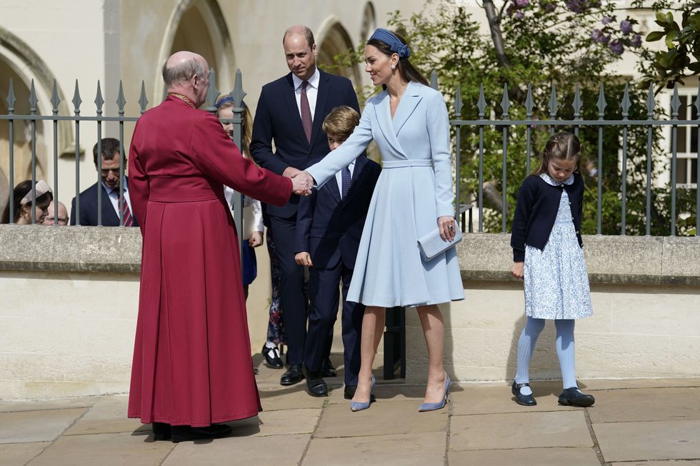 windsor, england   april 17 prince william, duke of cambridge, catherine, duchess of cambridge, prince george and princess charlotte say goodbye to dean of windsor, the right revd david conner, as they leave the easter matins service at st georges chapel at windsor castle on april 17, 2022 in windsor, england photo by andrew matthews wpa poolgetty images