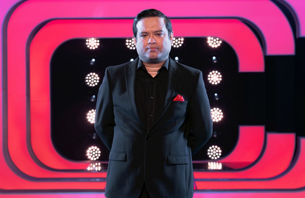 paul sinha of the chase, standing on the set for beat the chasers