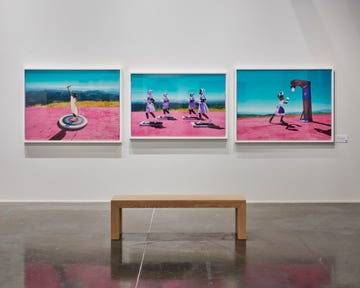 three photos in a gallery space