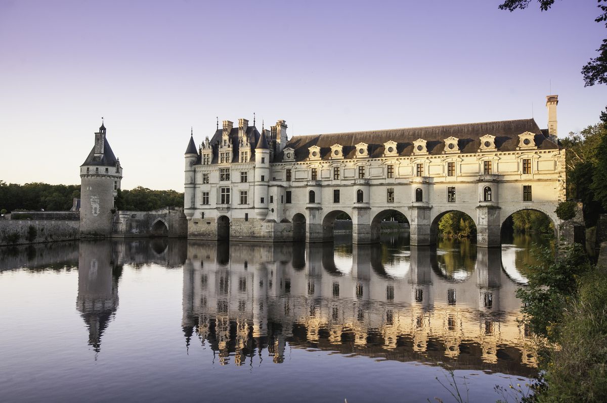 chateau de chenonceau glowing in the sunset, loire valley, france