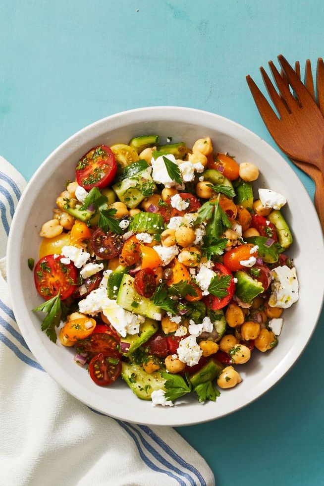 chickpea salad with smashed cucumbers, tomatoes and feta cheese