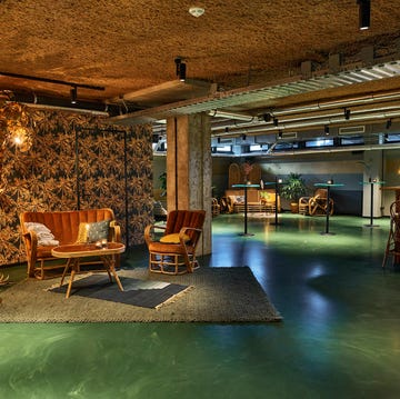Cheap Hotels Amsterdam - Hotel V Fizeaustraat large green and brown lobby area with a few chairs and tables