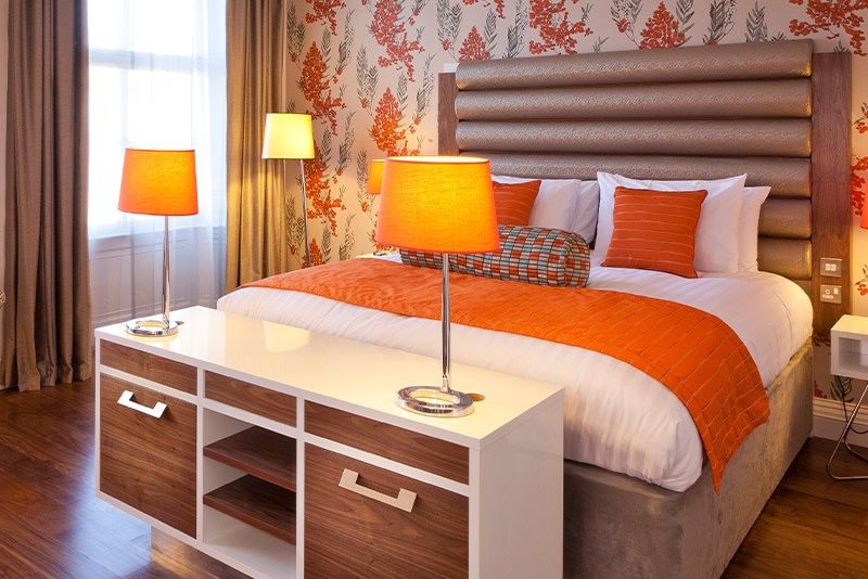 a double bed with lamps on either side at hotel indigo edinburgh