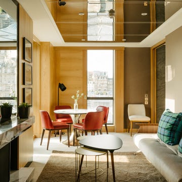 apartment room with sofa table and chairs at market street hotel