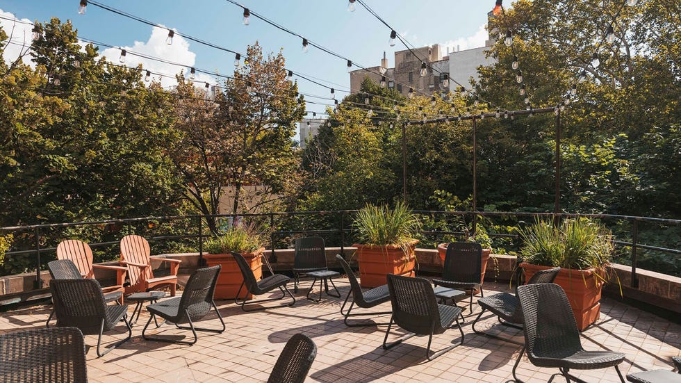 a terrace with chairs and tables