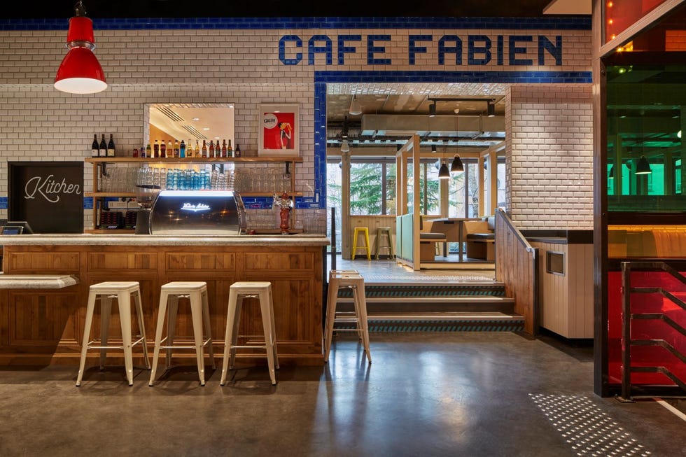 a bar with stools and a bar at generator paris