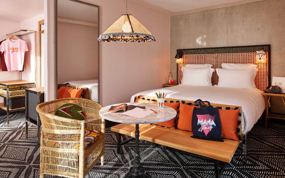 a bedroom with a bed and a chair at mama shelter west