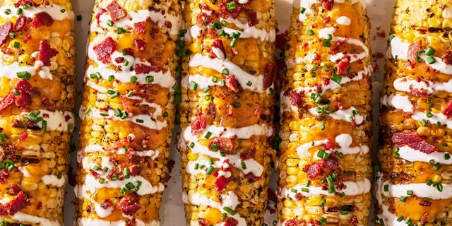 grilled corn with melted cheddar, bacon, and a drizzle of ranch