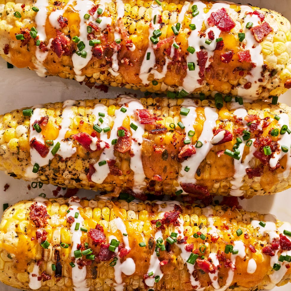 grilled corn with melted cheddar, bacon, and a drizzle of ranch