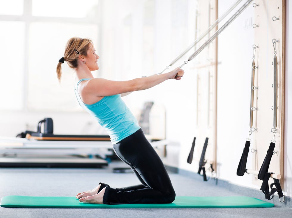 cheerful woman exercising in the gym