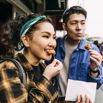 woman enjoying a snack while following an intermittent fasting schedule