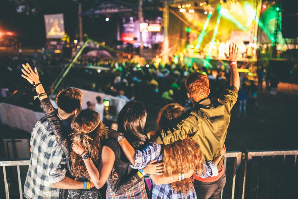 teens from back cheering on their favorite band