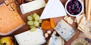 cheese platter with fruits and wine