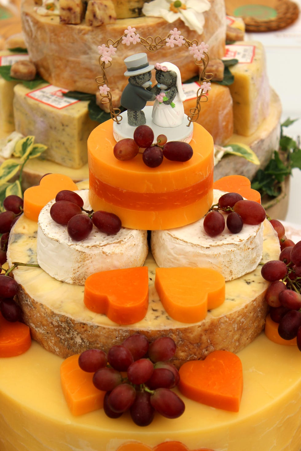 Cheese wedding cake, decorated cheese cake, Cheddar, Red-Leicester, brie, grapes