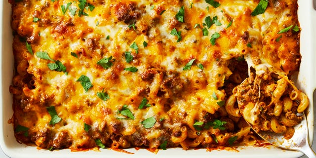 ground beef, pasta, sauce and cheese in a casserole dish