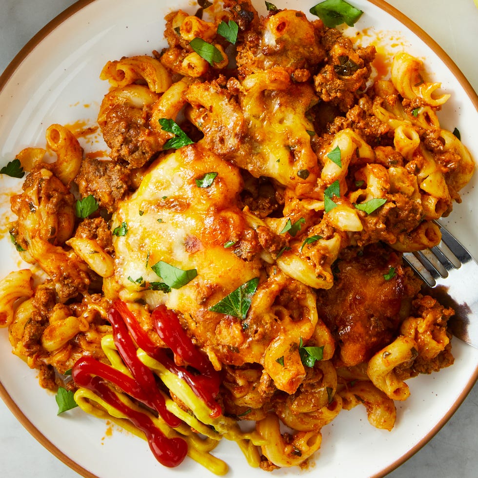 ground beef, pasta, sauce and cheese in a casserole dish