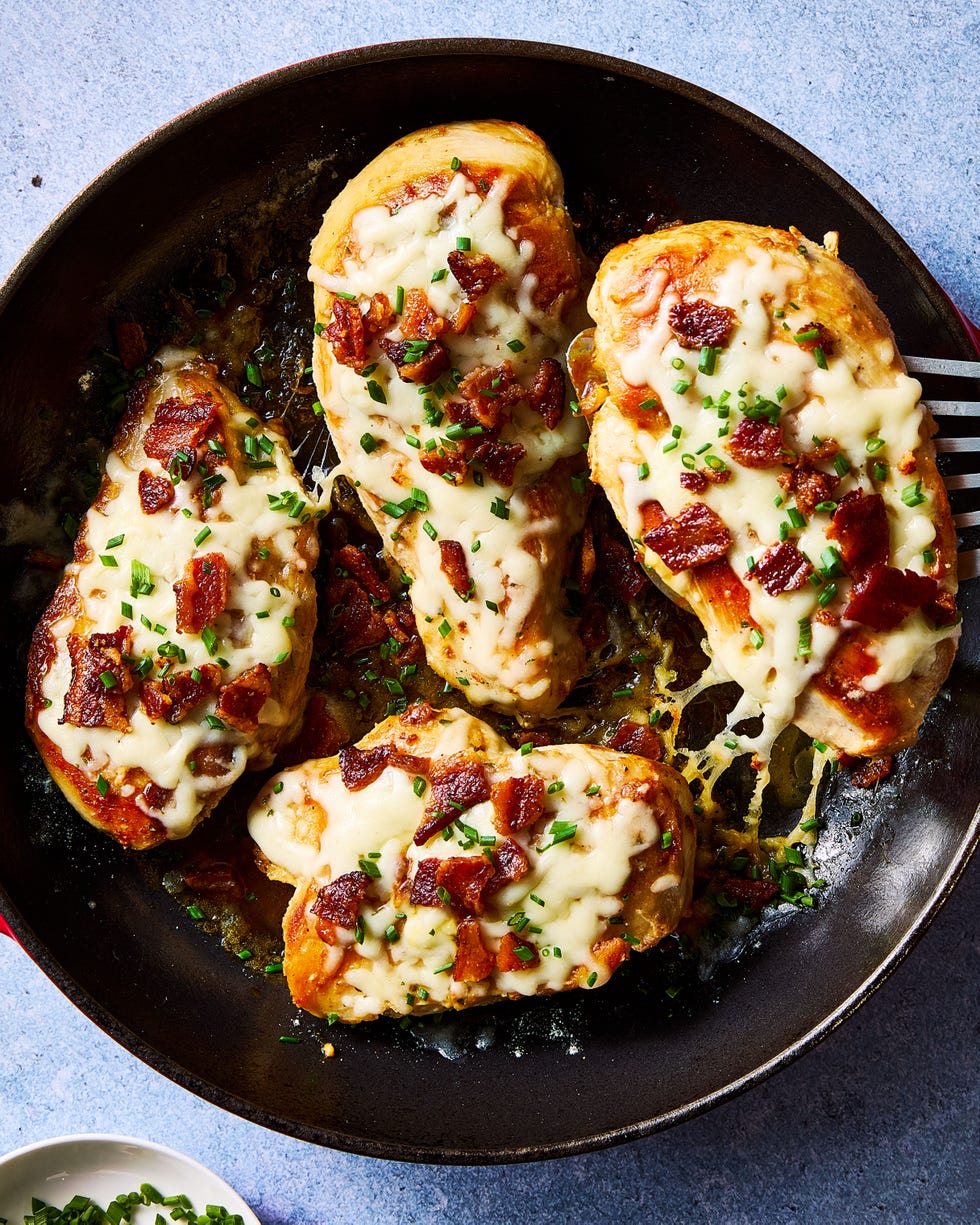 chicken breasts covered in bacon pieces and melted cheese