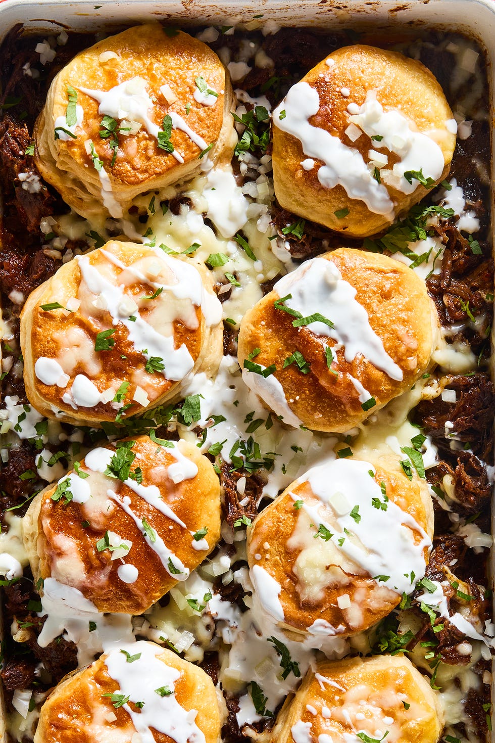 Cheesy Barbacoa Biscuit Bake casserole filled with barbacoa topped with biscuits