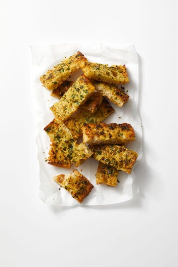 cheesy garlic bread on a white background
