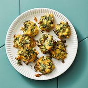 cheesy kale nests on a blue tile background
