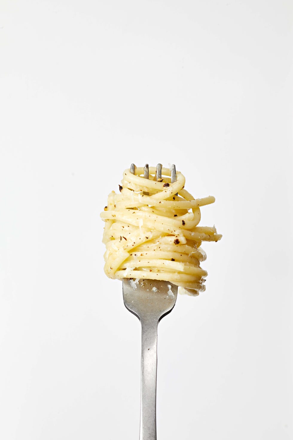 cheesy lemon pepper spaghetti on a fork