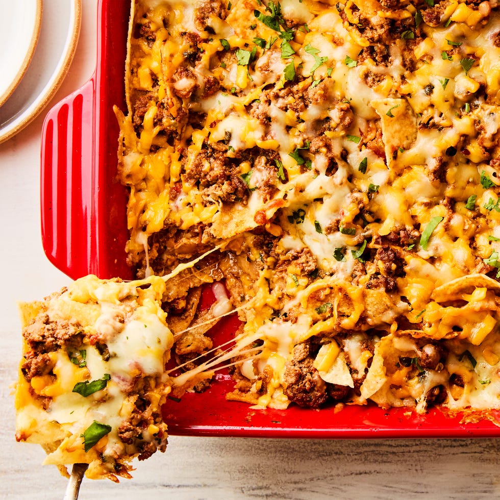 ground beef and cheese baked over chips in a casserole dish