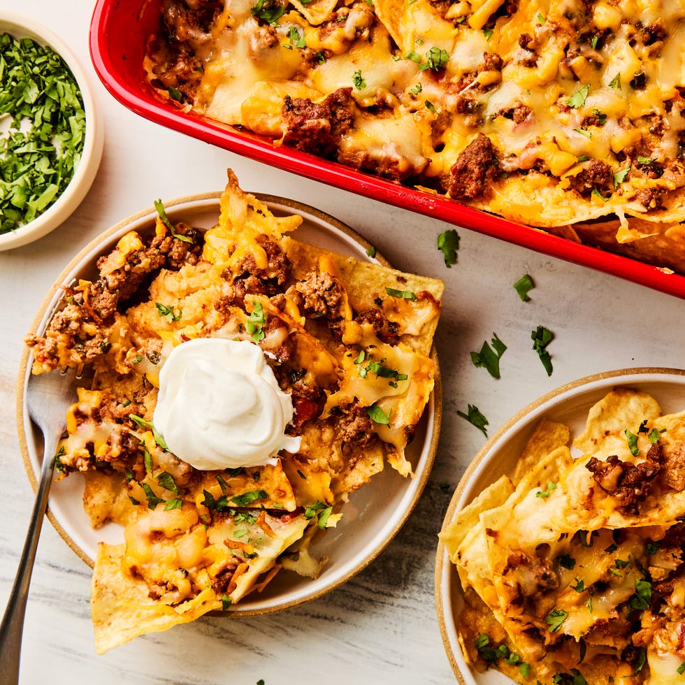 ground beef and cheese baked over chips in a casserole dish