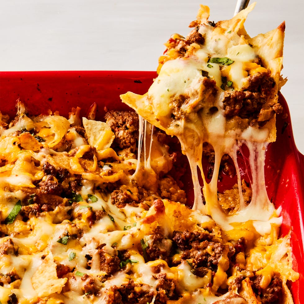 ground beef and cheese baked over chips in a casserole dish