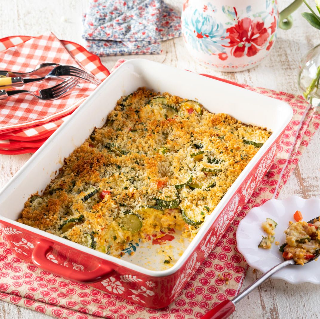 cheesy zucchini casserole in red dishes