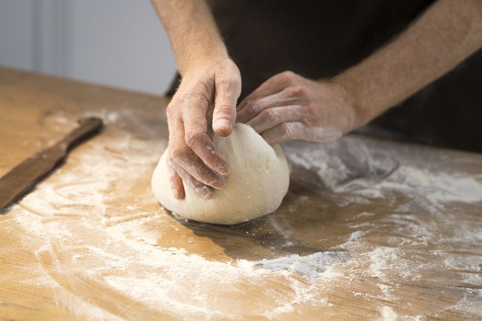 chef kneading dough
